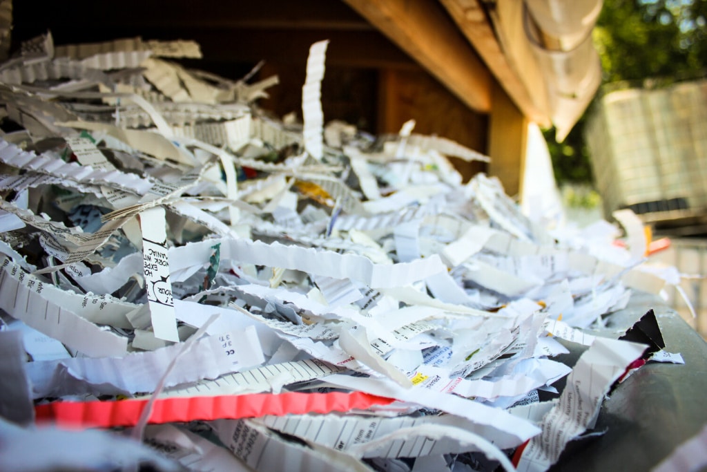 paper being shredded with Atlantic Shredding equipment
